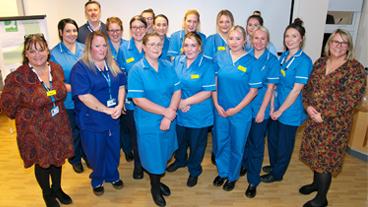 Group shot: Registered Apprentice Nurses with Donna Parkinson, Head of Learning, Education and Development, Juliet Pearce, Director of Nursing, Midwifery and AHPs, Darren Cattel, CEO Isle of Wight NHS Trust.